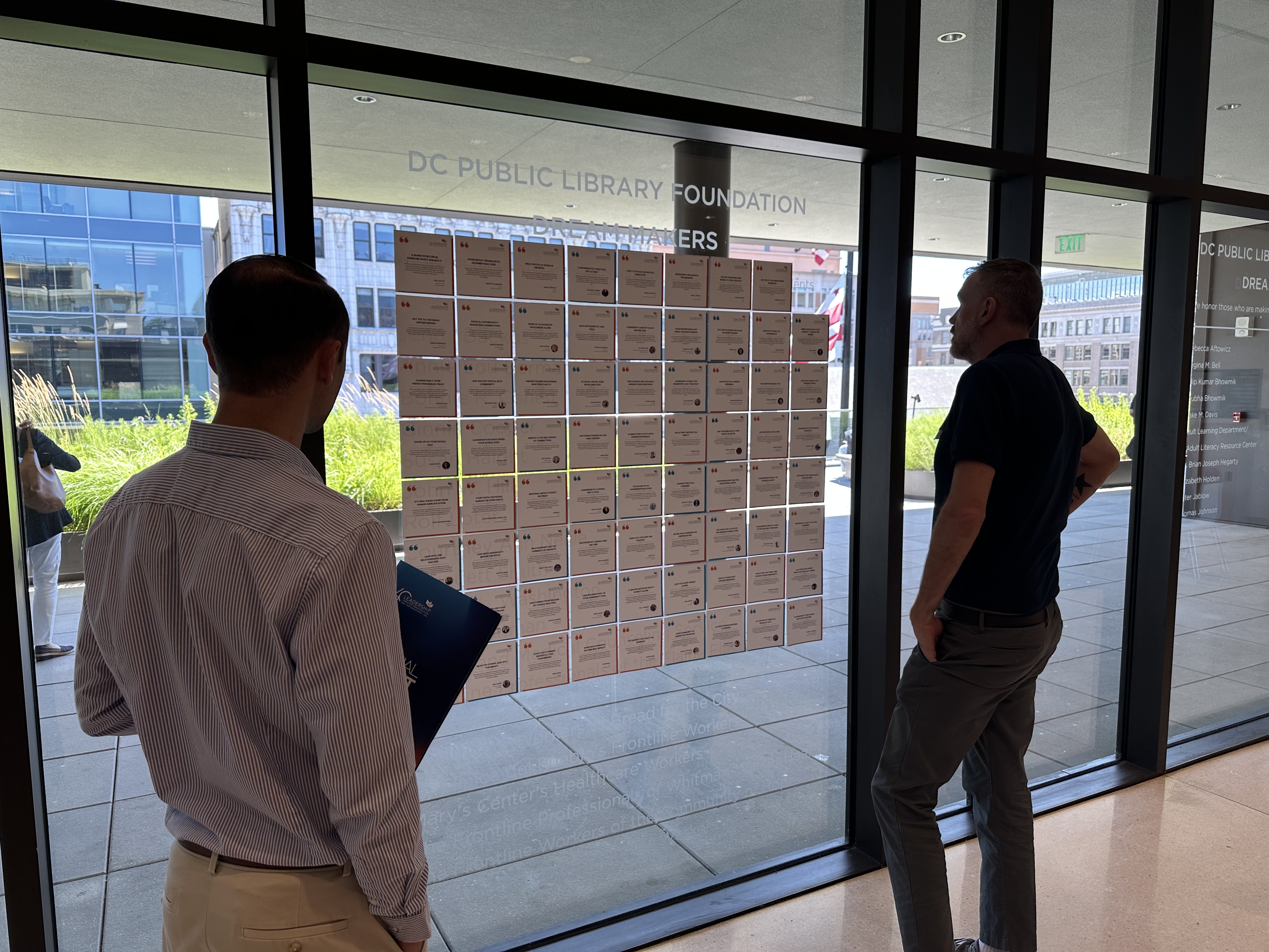 Members viewing the LGW Dream Makers story wall